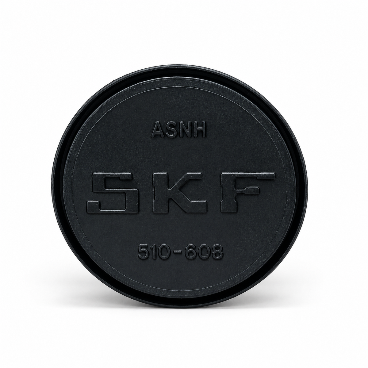 Zwarte SKF-afdekkap met reliëfmarkeringen.png
