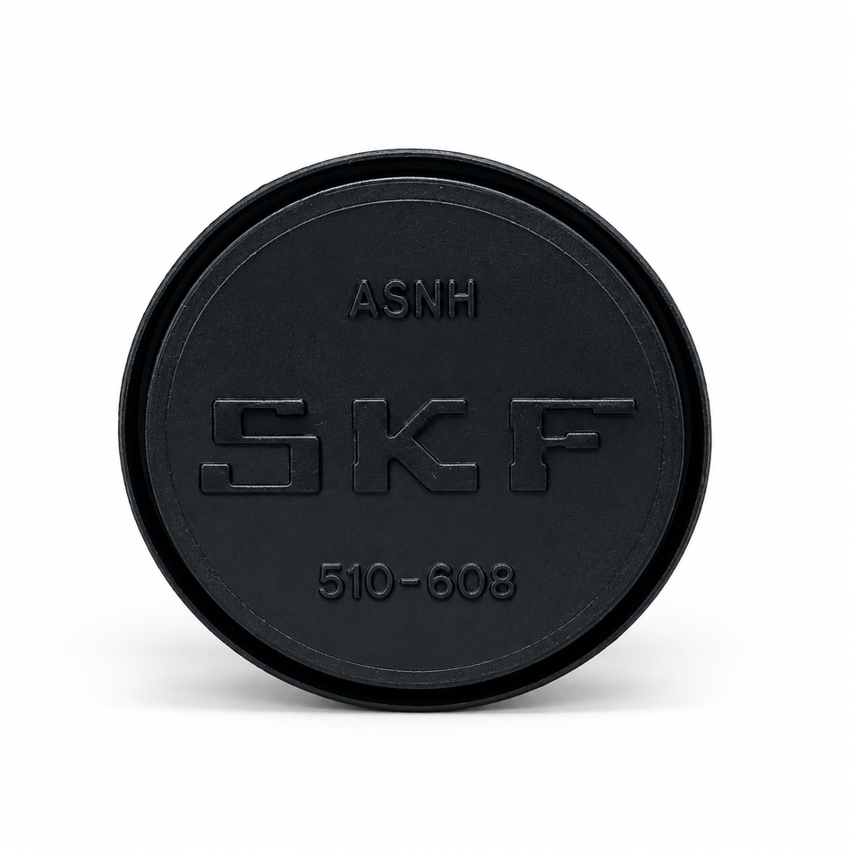 Zwarte SKF-afdekkap met reliëfmarkeringen.png
